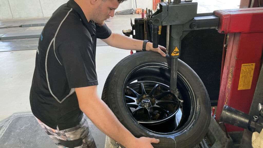Removing tyre at Branigans Tyres in the Gold Coast.